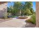 Charming courtyard fountain amidst manicured landscaping offering a tranquil and inviting outdoor space for residents at 5525 E Thomas Rd # O8, Phoenix, AZ 85018