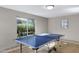 Community game room features a ping pong table with natural light, providing a recreational space for residents at 5525 E Thomas Rd # O8, Phoenix, AZ 85018