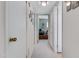 Hallway that leads to an office and storage area with neutrally painted walls and carpeted floors at 5525 E Thomas Rd # O8, Phoenix, AZ 85018