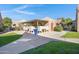 Exterior shot of the community mailboxes, with well-maintained landscaping and accessible walkways, on a sunny day at 5525 E Thomas Rd # O8, Phoenix, AZ 85018