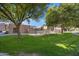 Community pool surrounded by lush greenery and a secure fence offering a serene and relaxing atmosphere at 5525 E Thomas Rd # O8, Phoenix, AZ 85018