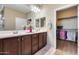 Spacious bathroom featuring double vanity, and walk-in closet access at 5652 W Cinder Brook Way, Florence, AZ 85132