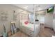 Stylish bedroom featuring a four-poster bed, personal workspace, a ceiling fan, and great natural light at 5725 S Topaz Pl, Chandler, AZ 85249