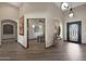 Elegant foyer with wood-look tile flooring and designer light fixtures at 5725 S Topaz Pl, Chandler, AZ 85249