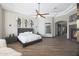 Spacious main bedroom with a ceiling fan, recessed lighting, artwork, and wood-look tile floors at 5725 S Topaz Pl, Chandler, AZ 85249