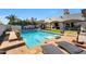 Backyard pool and patio area complete with lounge chairs and lush landscaping at 5725 S Topaz Pl, Chandler, AZ 85249