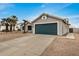 View of a well-kept attached garage with desert landscaping at 6303 E Preston St, Mesa, AZ 85215