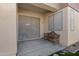 Covered patio featuring concrete flooring and a bench at 6392 W Pontiac Dr, Glendale, AZ 85308