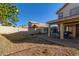 Spacious backyard with a covered patio, storage shed, and plenty of room for outdoor activities at 6544 E Portia St, Mesa, AZ 85215