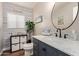 Charming powder room with beach accents, shiplap wall, and marble countertop at 6544 E Portia St, Mesa, AZ 85215