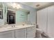Bathroom with single vanity, white cabinets, and shower/tub combo at 6544 E Portia St, Mesa, AZ 85215