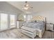 Bright bedroom with vaulted ceiling, large bed, and French doors at 6544 E Portia St, Mesa, AZ 85215