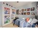 Bright bedroom with decorated walls, window, and carpeted floor at 6544 E Portia St, Mesa, AZ 85215