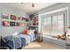 Bright bedroom with decorated walls, window, and carpeted floor at 6544 E Portia St, Mesa, AZ 85215