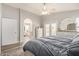 Bright bedroom with en-suite bathroom, walk-in closet and neutral color palette at 6544 E Portia St, Mesa, AZ 85215