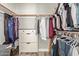 Walk-in closet featuring rods, shelves, and drawers for organization at 6544 E Portia St, Mesa, AZ 85215