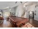 Bright living room featuring a billiard table, a staircase, and hardwood floors at 6544 E Portia St, Mesa, AZ 85215