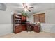 Functional office with generous cabinet space, a built-in desk, and a large window at 6544 E Portia St, Mesa, AZ 85215