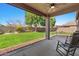 A view of the backyard featuring a patio, and a lush green lawn at 7346 N 82Nd Ave, Glendale, AZ 85303