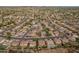 Wide aerial view of community homes, desert landscaping, pools and mountain views in the background at 7381 W Paso Trl, Peoria, AZ 85383