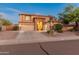 Charming two-story home with a three car garage, stone accents and a well manicured, low maintenance yard at 7381 W Paso Trl, Peoria, AZ 85383