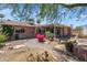 Landscaped backyard with stone pavers and a covered patio for outdoor living at 7526 E Edgemont Ave, Scottsdale, AZ 85257