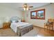 Light and airy bedroom features a white wicker headboard and natural textures at 7526 E Edgemont Ave, Scottsdale, AZ 85257