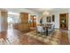 View of dining room connecting to a kitchen with wooden cabinetry and tiled floors at 7526 E Edgemont Ave, Scottsdale, AZ 85257