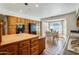 Bright kitchen featuring wood cabinetry and an adjacent breakfast nook with natural light at 7526 E Edgemont Ave, Scottsdale, AZ 85257