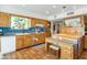 Bright kitchen featuring wooden cabinets and a decorative stained glass window at 7526 E Edgemont Ave, Scottsdale, AZ 85257
