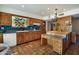 Charming vintage kitchen features Saltillo tile floors, wood cabinets, and a colorful stained glass window at 7526 E Edgemont Ave, Scottsdale, AZ 85257