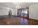 Bright and spacious living room features Saltillo tile floors, French doors and two elegant chandeliers at 7526 E Edgemont Ave, Scottsdale, AZ 85257