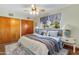 Bedroom with wood floors, soft colors, and a light gray window treatment at 7526 E Edgemont Ave, Scottsdale, AZ 85257