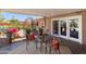 Covered patio with comfortable seating, perfect for outdoor relaxing and entertaining at 7526 E Edgemont Ave, Scottsdale, AZ 85257