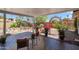 Covered patio has outdoor dining area and views of the garden at 7526 E Edgemont Ave, Scottsdale, AZ 85257