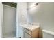 Bathroom featuring tiled counter vanity and a glass door shower at 7530 E Mariposa Dr, Scottsdale, AZ 85251