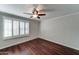 Bedroom with hardwood floors, shutters, ceiling fan at 7530 E Mariposa Dr, Scottsdale, AZ 85251