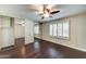 The spacious bedroom includes wood floors, ample closet space and ceiling fan at 7530 E Mariposa Dr, Scottsdale, AZ 85251