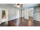 A well lit room with wood floors and a mirrored closet at 7530 E Mariposa Dr, Scottsdale, AZ 85251