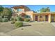 View of home with well kept landscaping, driveway and beautiful exterior paint at 7530 E Mariposa Dr, Scottsdale, AZ 85251