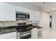 Modern kitchen features stainless steel appliances and sleek countertops at 7530 E Mariposa Dr, Scottsdale, AZ 85251