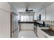 Modern kitchen with white cabinetry, stainless steel appliances, and sleek countertops at 7530 E Mariposa Dr, Scottsdale, AZ 85251