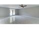 An open living room with tile floors and a ceiling fan at 7530 E Mariposa Dr, Scottsdale, AZ 85251