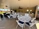 Covered outdoor patio area with tables, chairs, and a built-in bar, ideal for entertaining at 7530 E Mariposa Dr, Scottsdale, AZ 85251