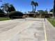 Outdoor shuffleboard court with palm trees and blue sky, ready for some fun in the sun at 7530 E Mariposa Dr, Scottsdale, AZ 85251
