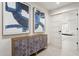 Hallway features statement art and a decorative cabinet at 7816 S Lakeshore Dr, Tempe, AZ 85284