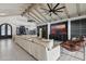 Comfortable living room featuring a large sofa, sleek entertainment center, and sophisticated design elements at 7816 S Lakeshore Dr, Tempe, AZ 85284