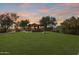 Community park with a covered ramada, a stone BBQ, and lush green lawn at 8171 E Angel Spirit Dr, Scottsdale, AZ 85255