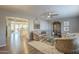 Living room features wood floors and views into the kitchen and dining area at 8305 E Lomita Ave, Mesa, AZ 85209