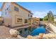 Resort style pool and spa nestled in a private backyard with mature desert landscaping at 9102 E Pershing Ave, Scottsdale, AZ 85260